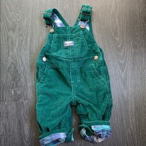 OshKosh hunter green corduroy overalls.
